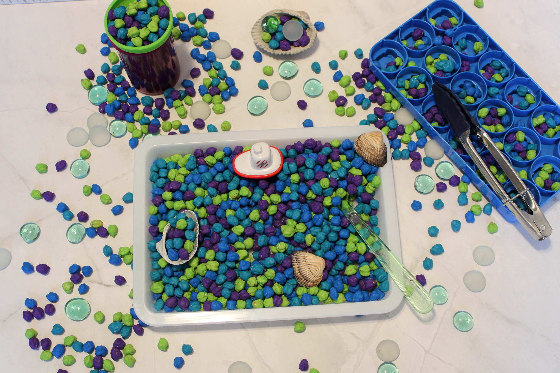 under the sea themed sensory bin on a counter