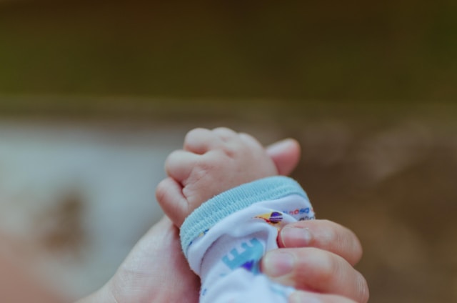 hand holding a baby hand